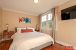 Third bedroom on second floor, presents a queen-sized bed & bedside table lamps -best for reading-